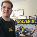Jon Hein with University of Michigan football gift picture book WOLVERINE: A Photographic History of Michigan Football, Vol. 1